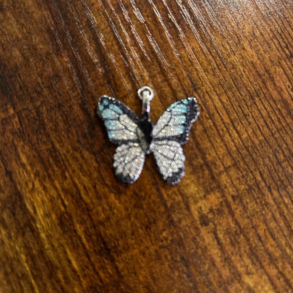 Blue black and silver butterfly pendant charm.
